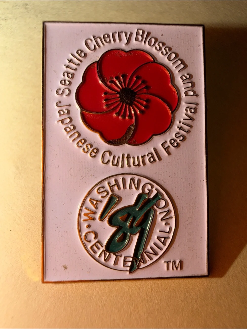 Source Unknown Pink Enamel Pin with Red Poppy and Green Logo